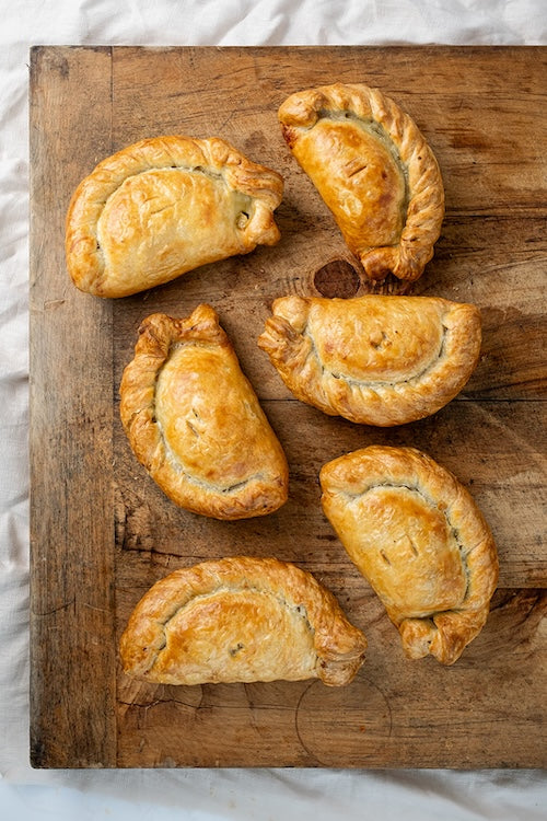 The 'Ansum Pasty Co. - 6 Pasties Freshly Baked on a Board.